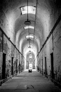 Prison hallway in grayscale photo
