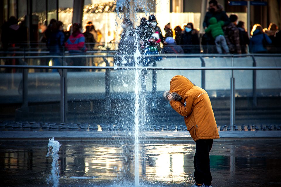Kid playing with water photo