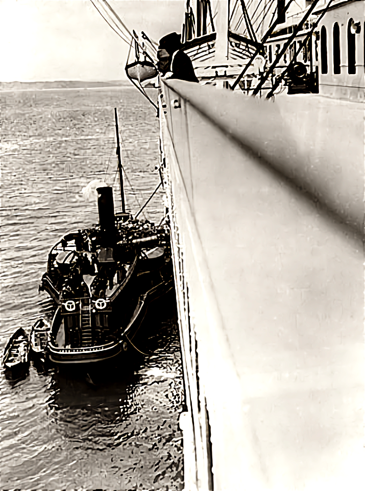 Tug America along side the Titanic at Cobh