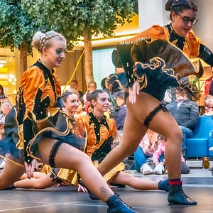 Cheerleader and dancer performing on stage