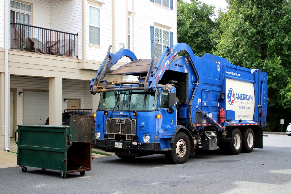 American Disposal truck 167 doing trash in Condos photo