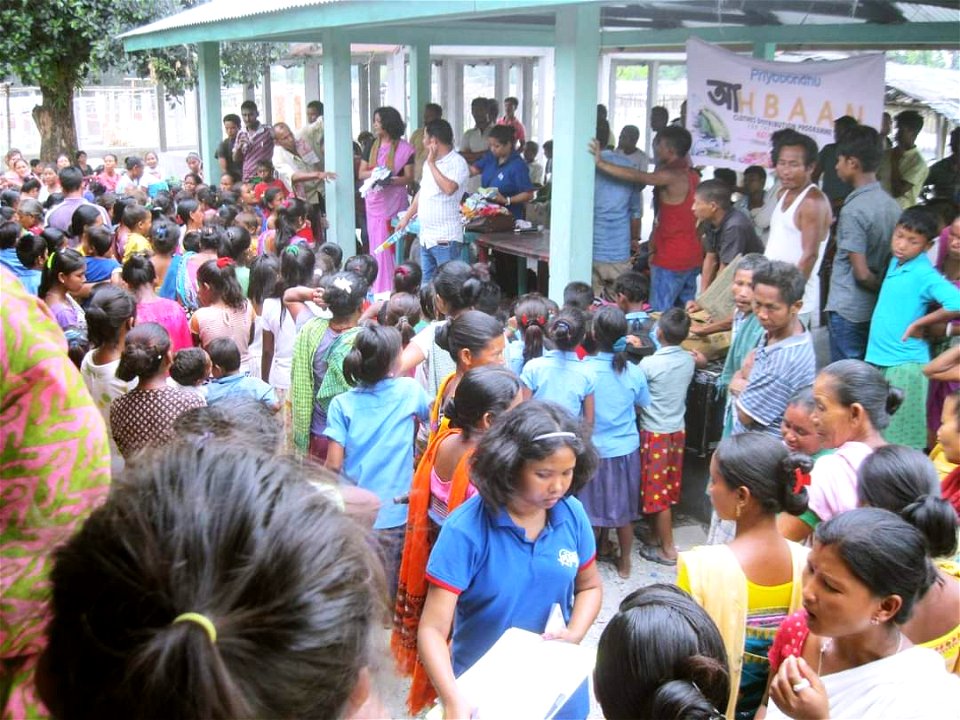 Social Worker Archana Borthakur (Archie) donating to needy