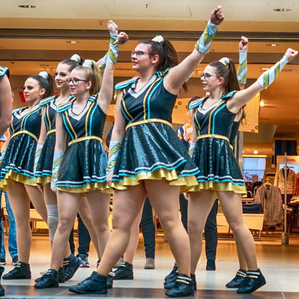 Cheerleader and dancer performing on stage