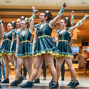 Cheerleader and dancer performing on stage photo