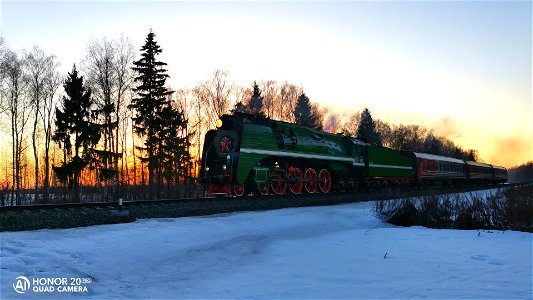 Steam locomotive P36-0147 with a commuter train photo
