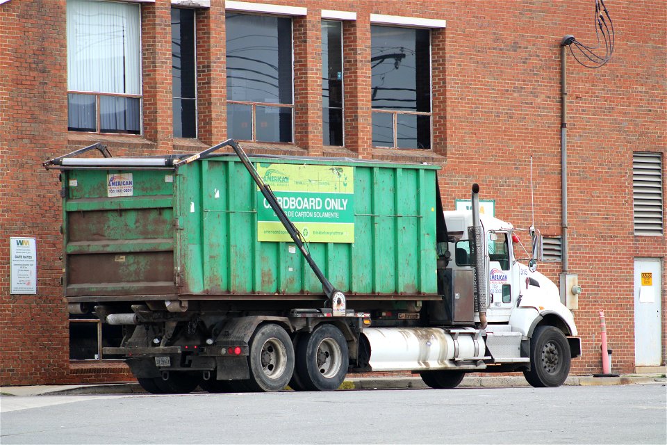 American 315 with a cardboard dumpster