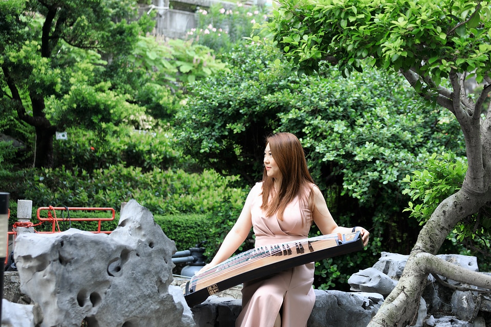 Asian Woman Play traditional Instrument photo