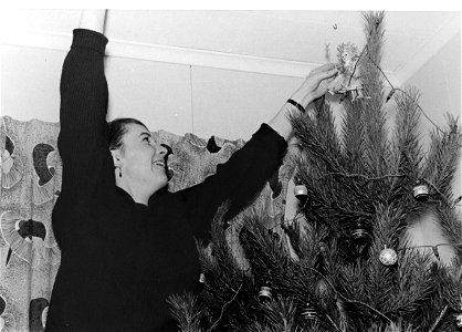 Christine decorating Xmas tree - 1966