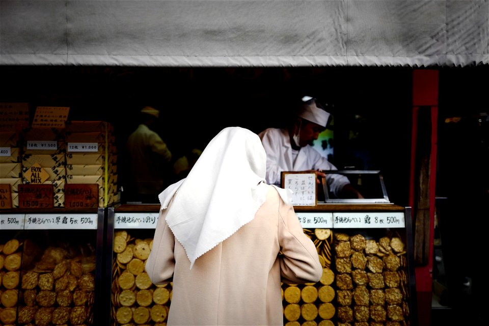 Woman at counter in Tokyo, Japan