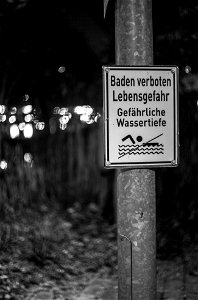 Warning sign at night photo