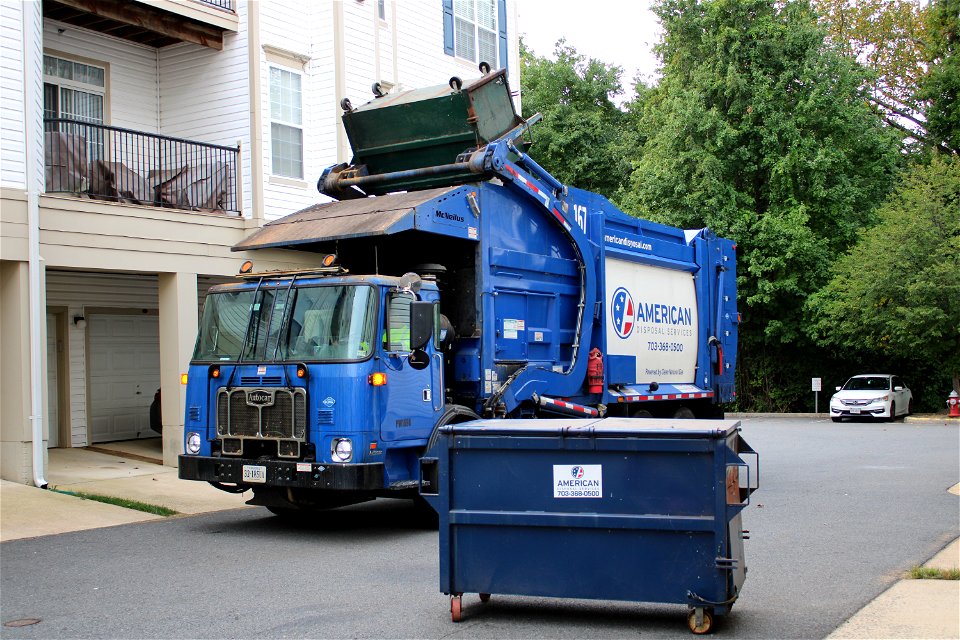 American Disposal truck 167 doing trash in Condos