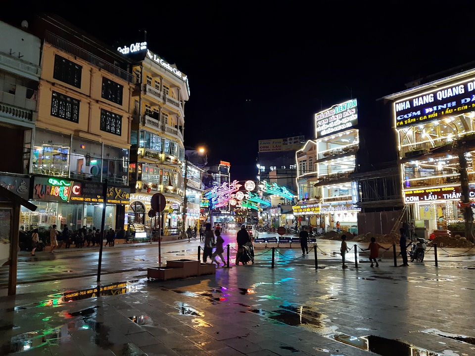 Tourist enjoying nightlife in downtown of Sapa