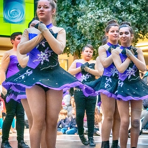 Cheerleader and dancer performing on stage