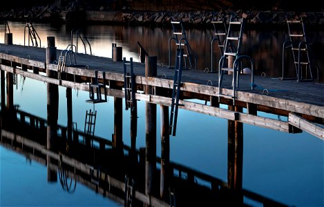 Jetty with the ladders in last light of the day photo