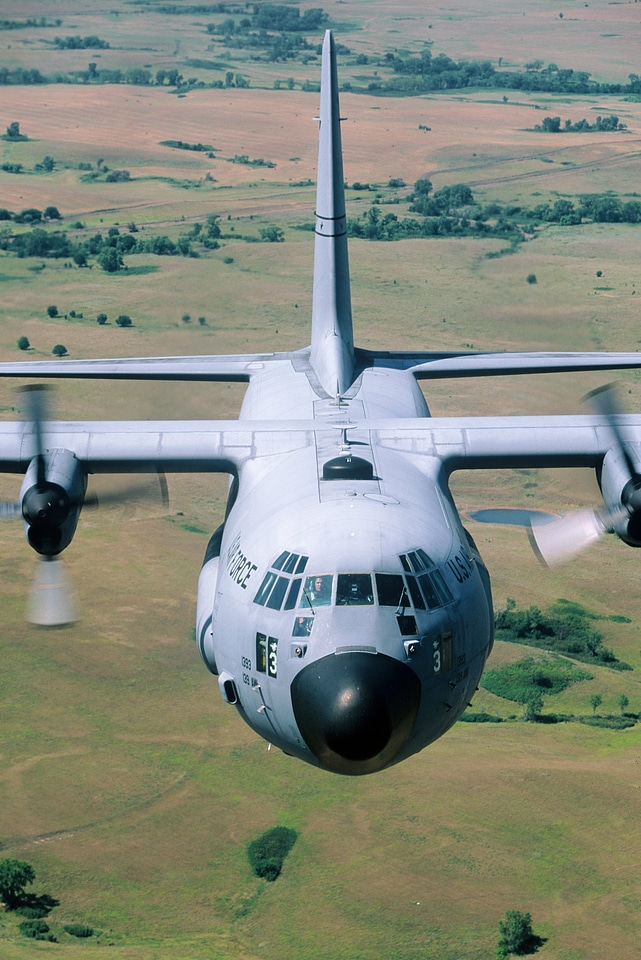 C-130 close up flying clear sky