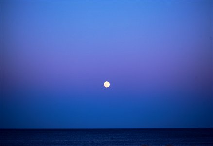 April Supermoon Pink Moon over Atlantic Ocean 2021 photo