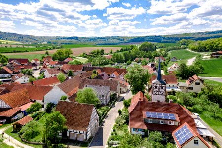 Dorf mit Fachwerkhäusern mit Kirche in Unterfranken photo