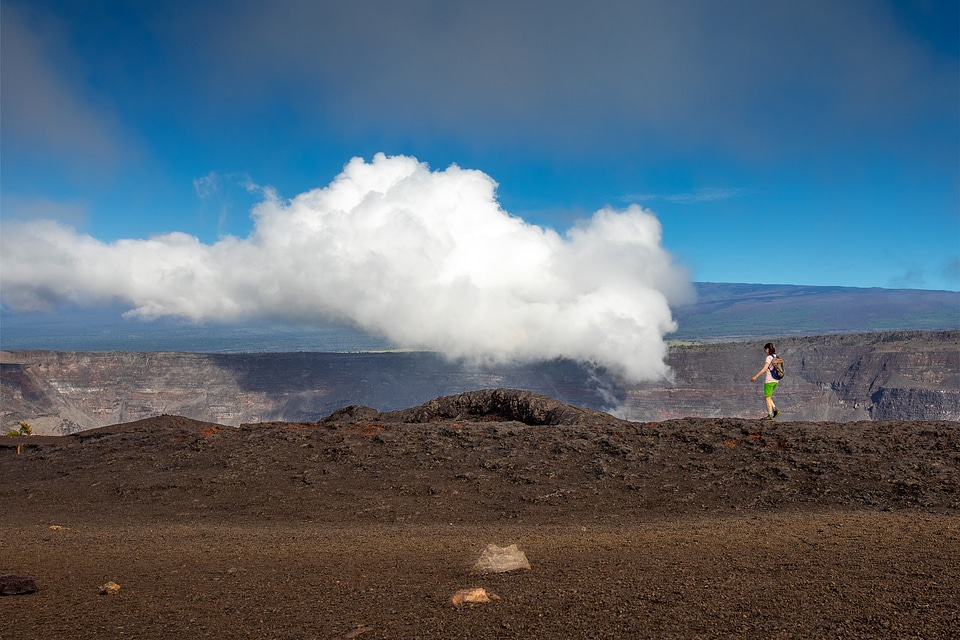 A visitor explores the fissure eruption from Kīlauea volcano