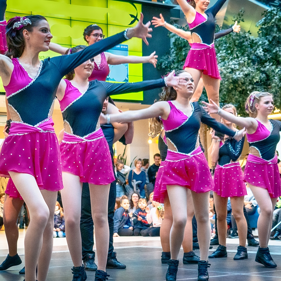 Cheerleader and dancer performing on stage