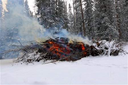 Slash Pile Burning in Snow (2) photo