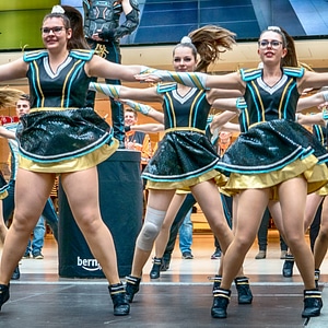 Cheerleader and dancer performing on stage