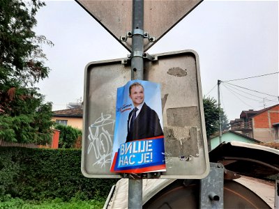 Pre-election poster  with Banja Luka's mayor candidate on the other side of road sign in Braće Jugovića street in Banja Luka