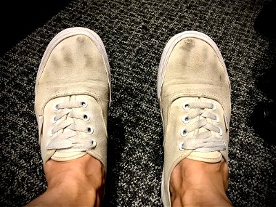 Dirty white vans get a small hole photo