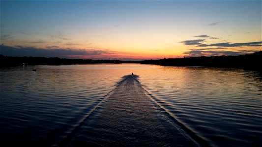 A Jetski riding off into the sunset