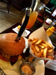 Beef Burger with chips with a hurricane Cocktail