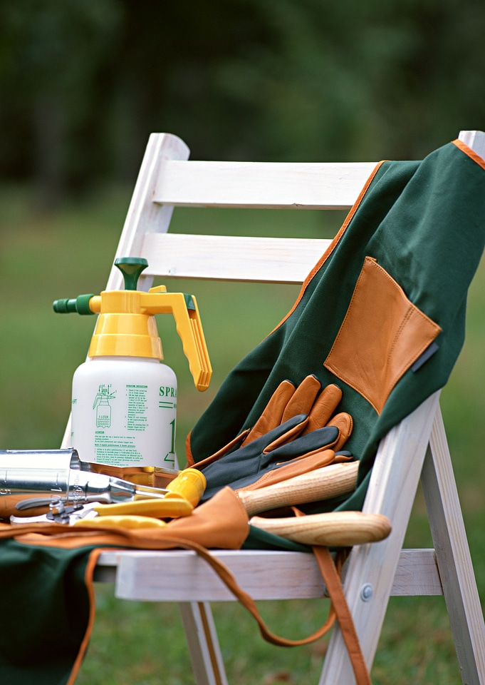 Gardening tools on white chair