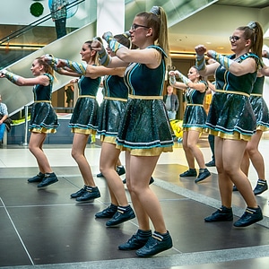 Cheerleader and dancer performing on stage