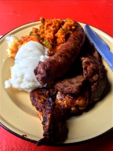 Here is an original South African Braai Meat, sausage with pap and Chakalaka at Chaf Pozi at the Soweto Towers in South Africa. Including video Picture the Food returns in 2021 with new Foods from around the world! photo