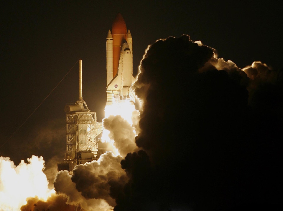Space shuttle taking off on a mission