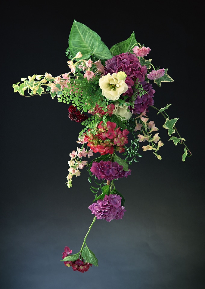 Vintage bunch of garden flowers isolated on black background.