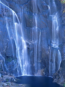 Waterfall in mountain photo