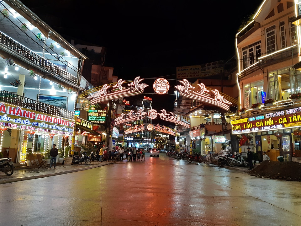 Tourist enjoying nightlife in downtown of Sapa