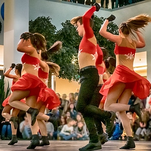Cheerleader and dancer performing on stage