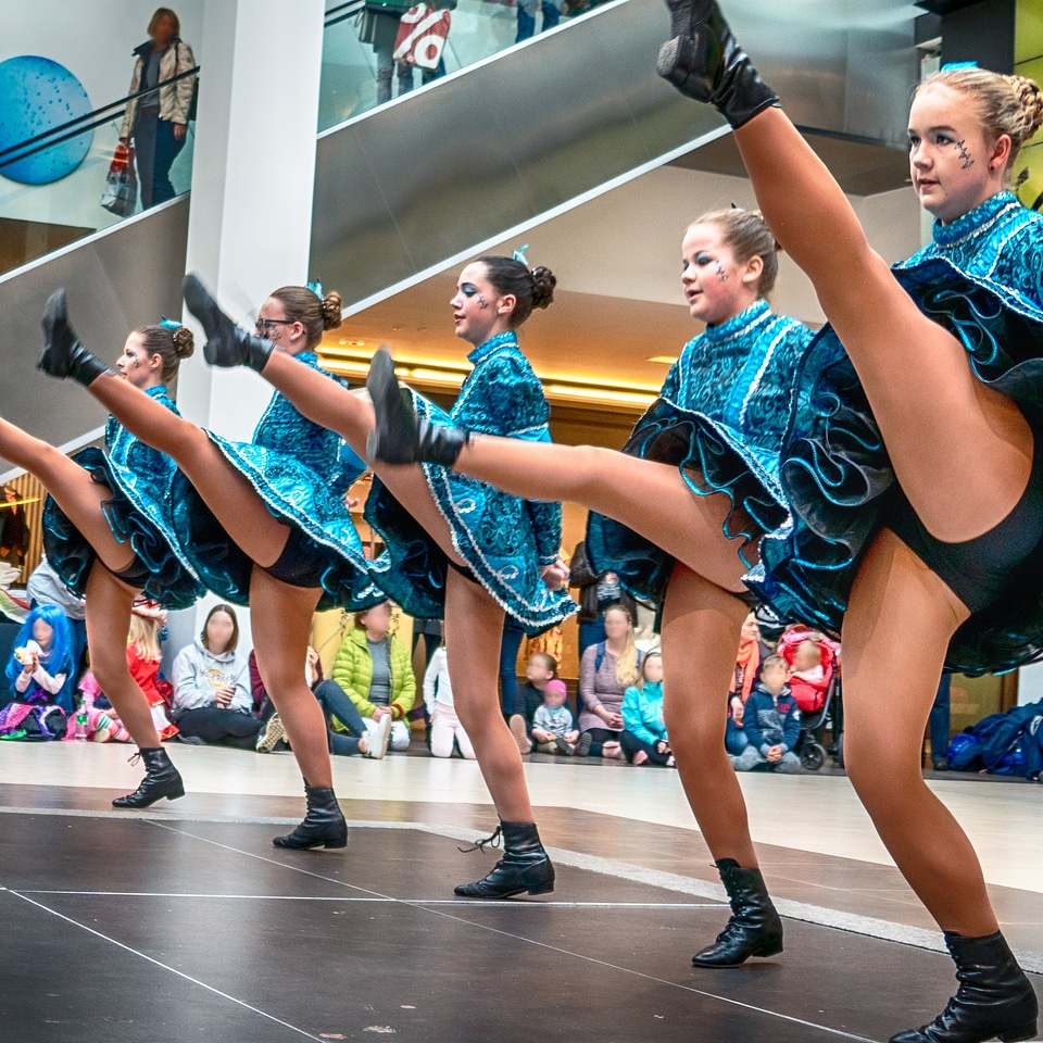 Cheerleader and dancer performing on stage
