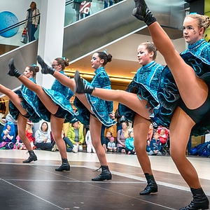 Cheerleader and dancer performing on stage