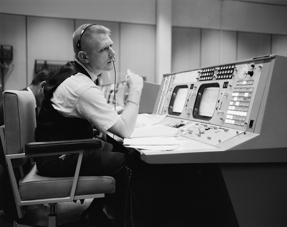 The flight director, is shown at his console