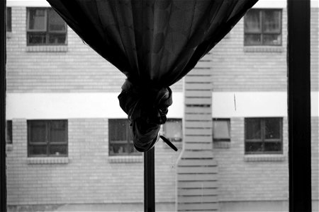 Curtain hanging from a window photo