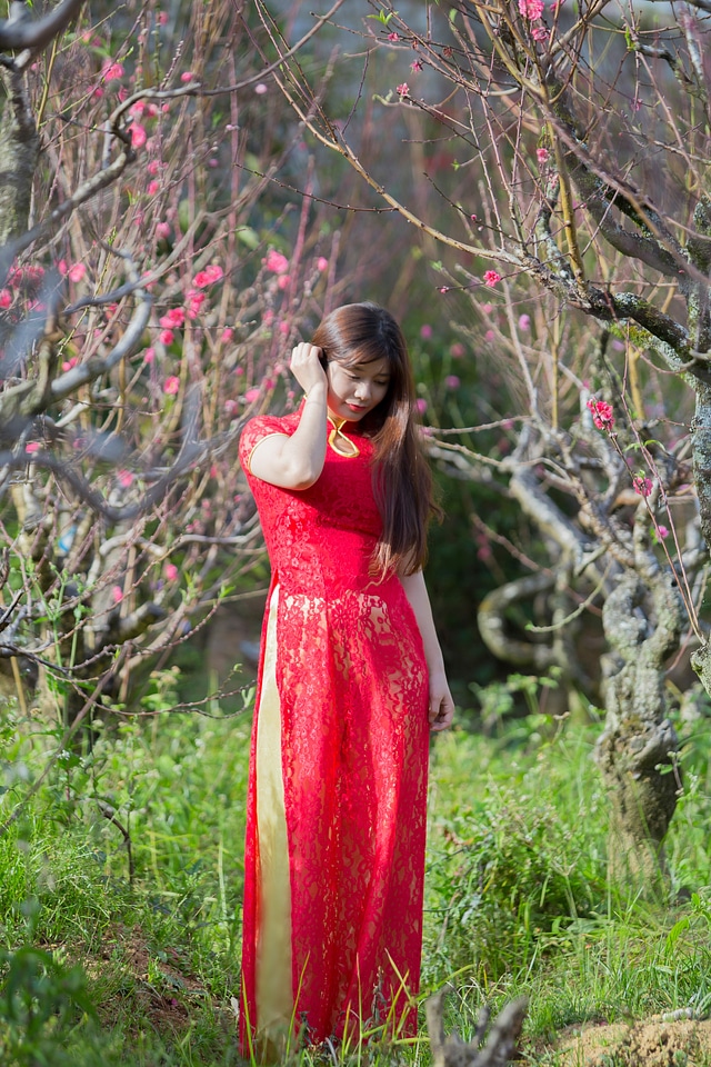 beautiful young Chinese girl smiling in spring garden