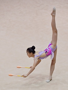 Beautiful rhythmic gymnast in professional arena