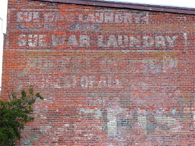 Sue War Laundry Ghost sign in Chinatown, Victoria British Columbia