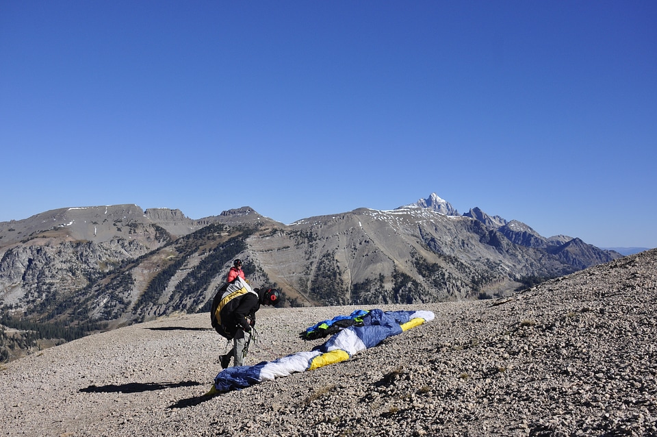 Paraglider prepareing to take off from a mountain