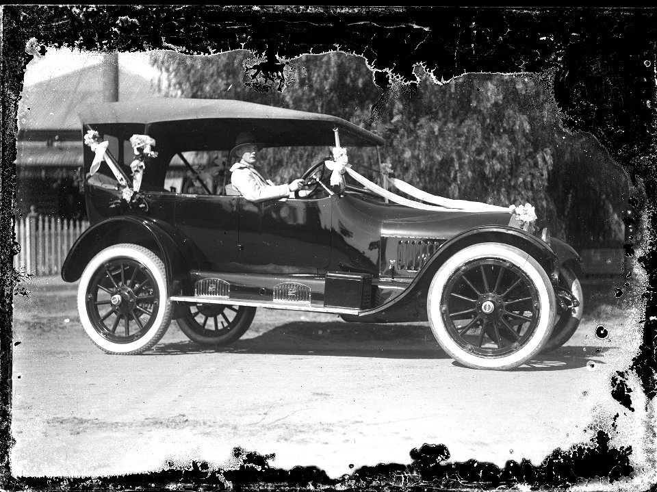 Car in a parade, or possibly, a wedding car, [n.d.]