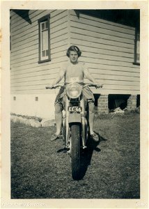 Jean Foster astride a motorcycle, [n.d.] photo