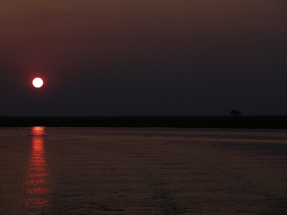 Red sunset over river