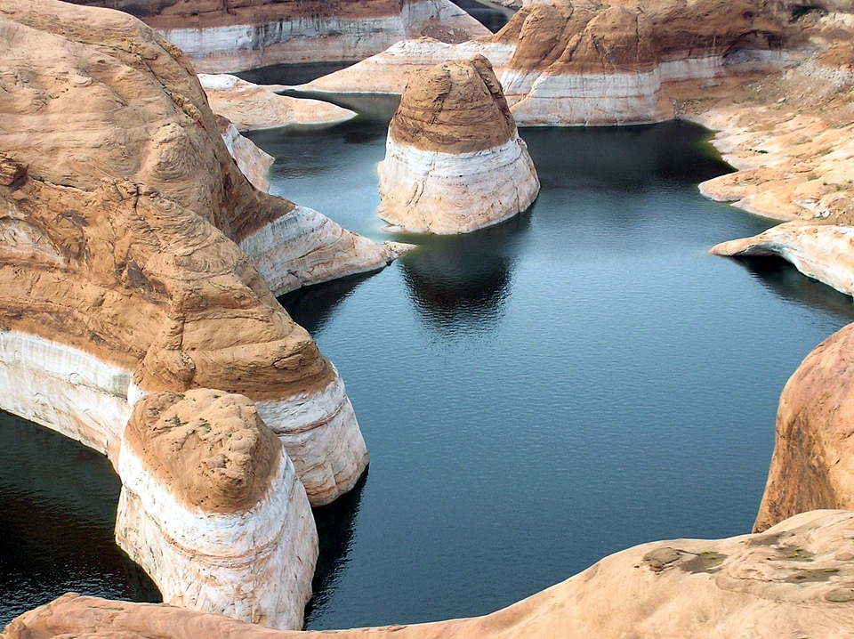 A hiker overlooking Reflection Canyon, Glen Canyon National