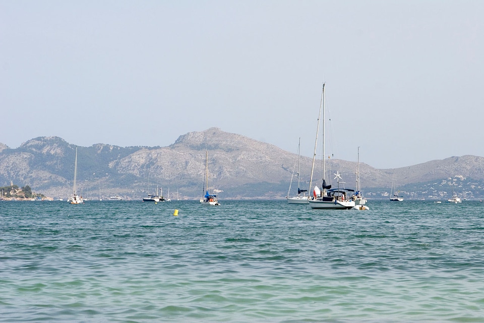 Sailboats idling in a Mediterranean bay